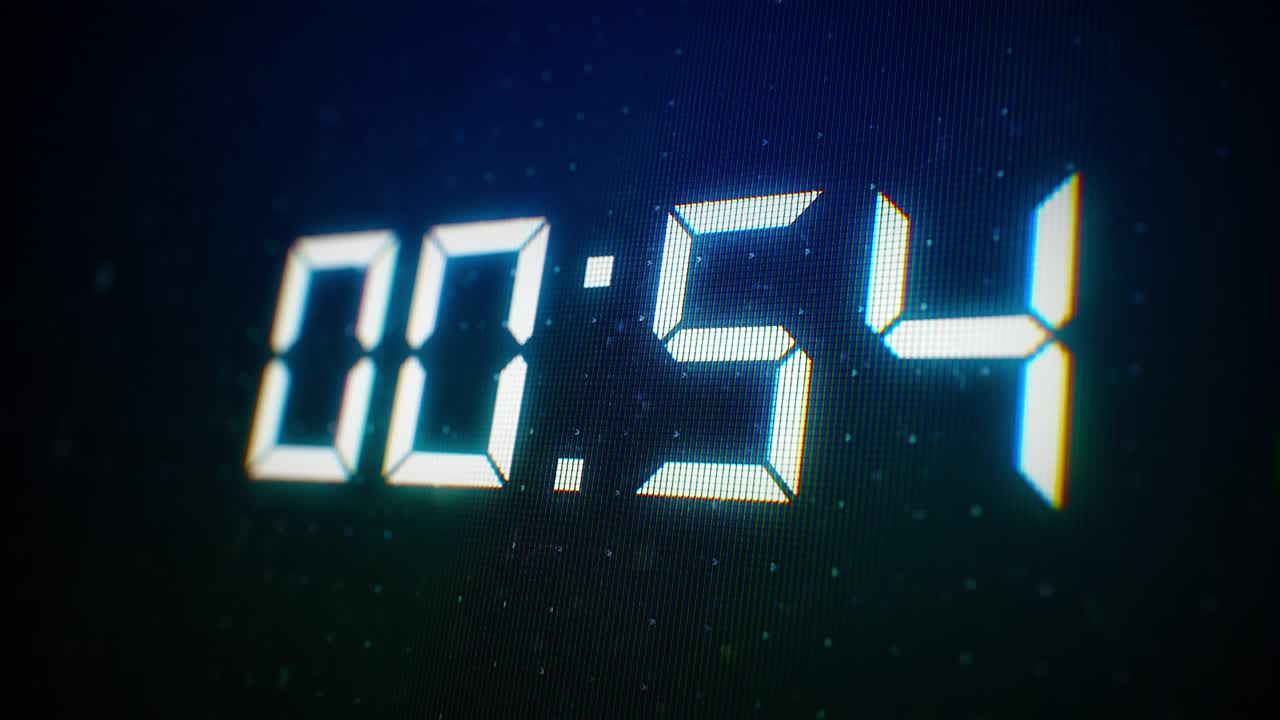 Close-up of 60 Seconds countdown White numbers on a Computer Screen in Defocus. 1 minute countdown. 30 or 10 seconds. White digits on a Black Background