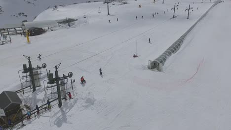 draglift and people skiing in alto campoo ski resort aerial shot