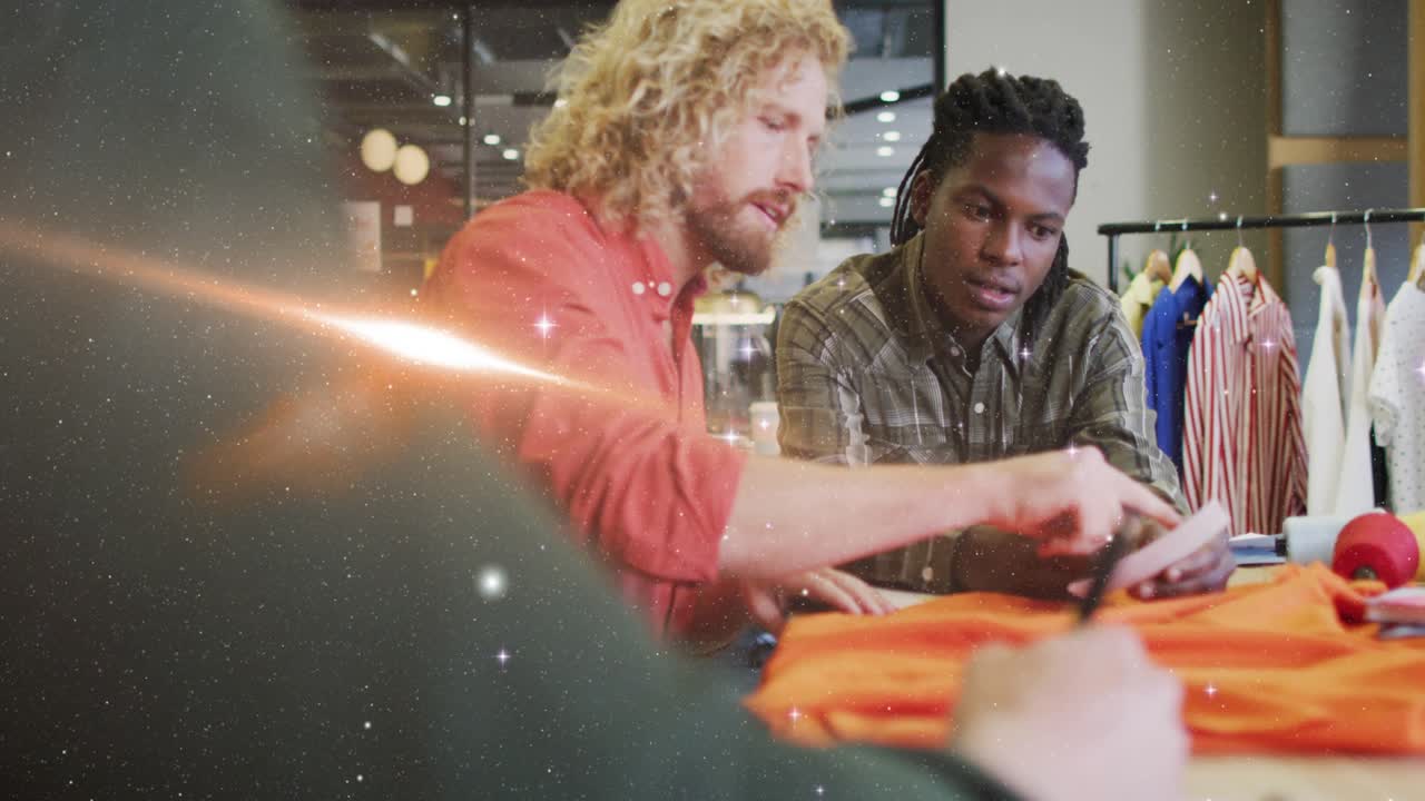 Two men tapping phone in sports shop, in orange shirt, seeking match prediction and causing sparkle