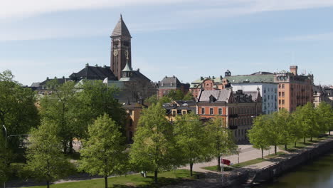 norrkoping, sweden, aerial rise up motala river fountain and city hall