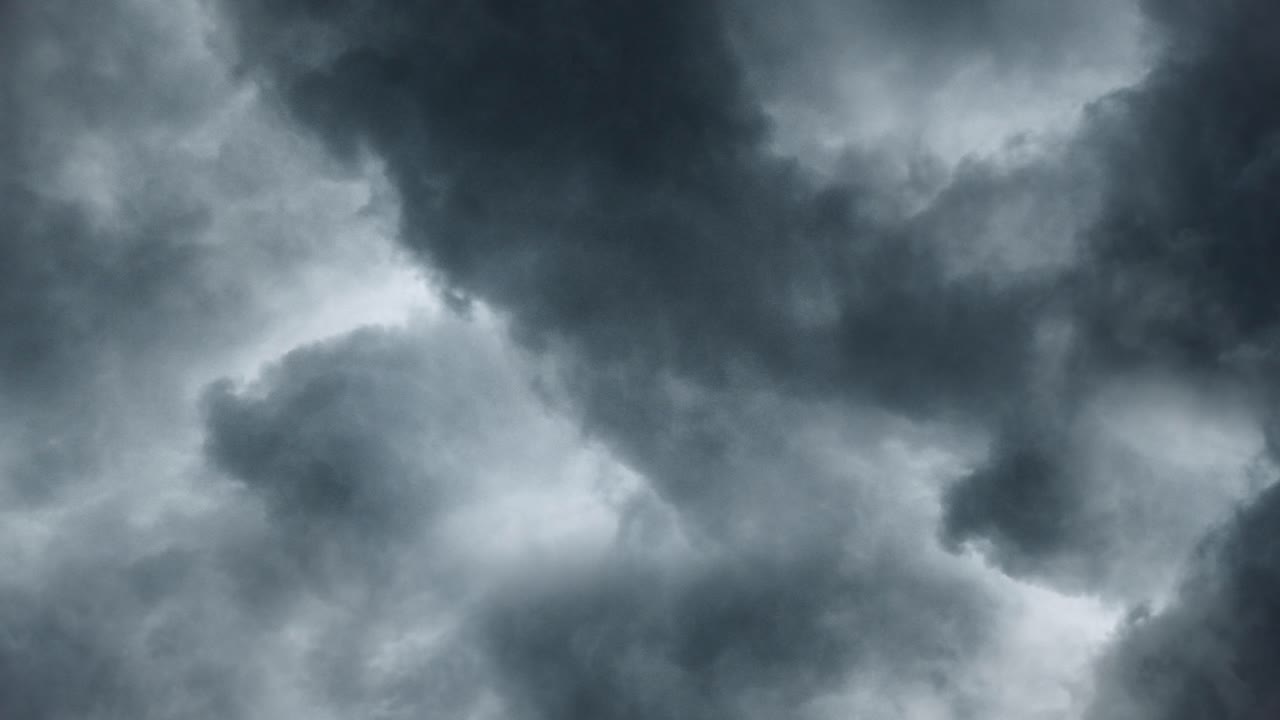 flying gray clouds over the sky and thunderstorm
