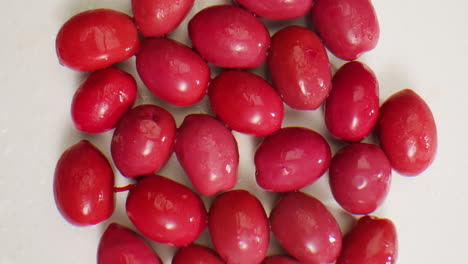 pickled round green olives from greece as background, top view. high quality 4k footage