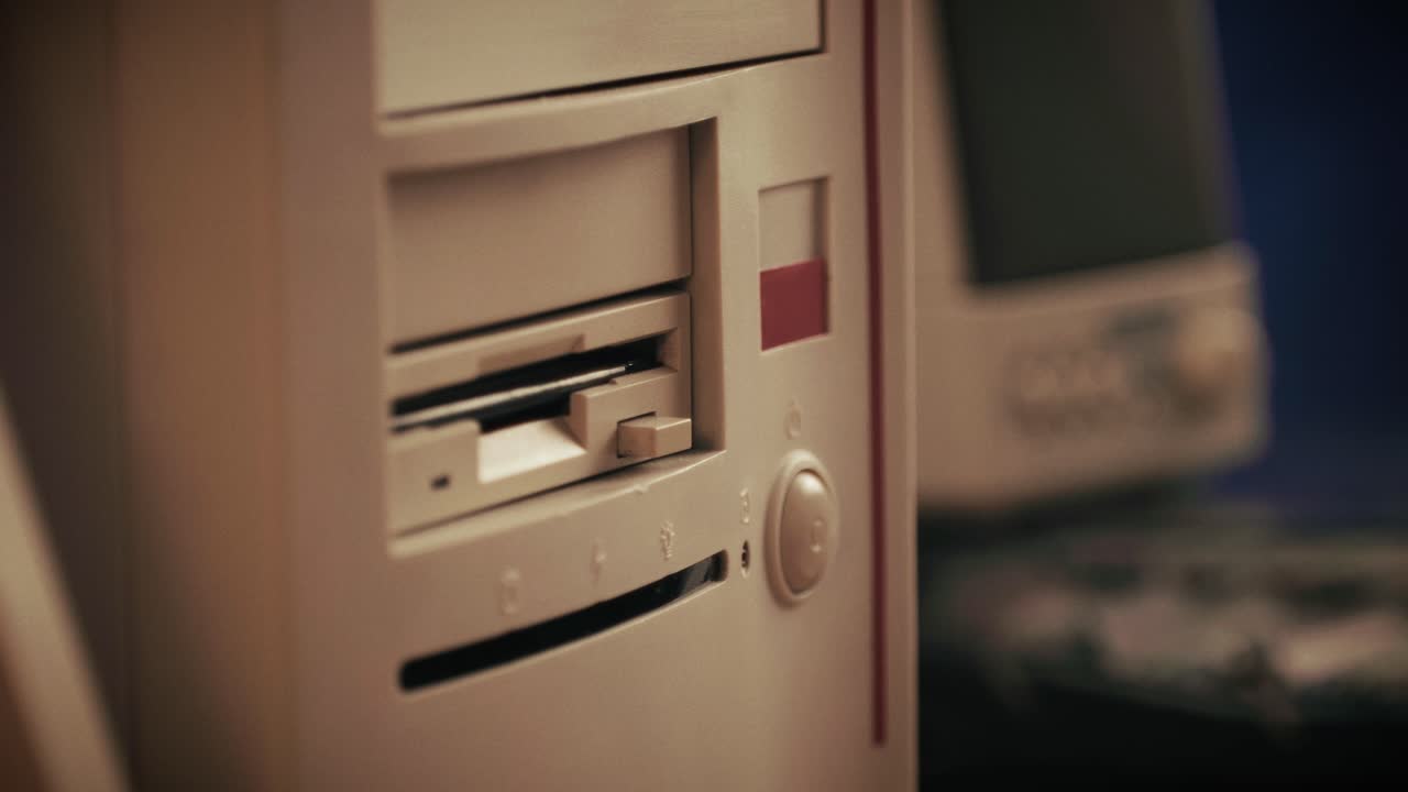 Using diskette for old computer. Music recorder, playing retro computer games. Vintage device for office, obsolete technology. . High quality 4k footage