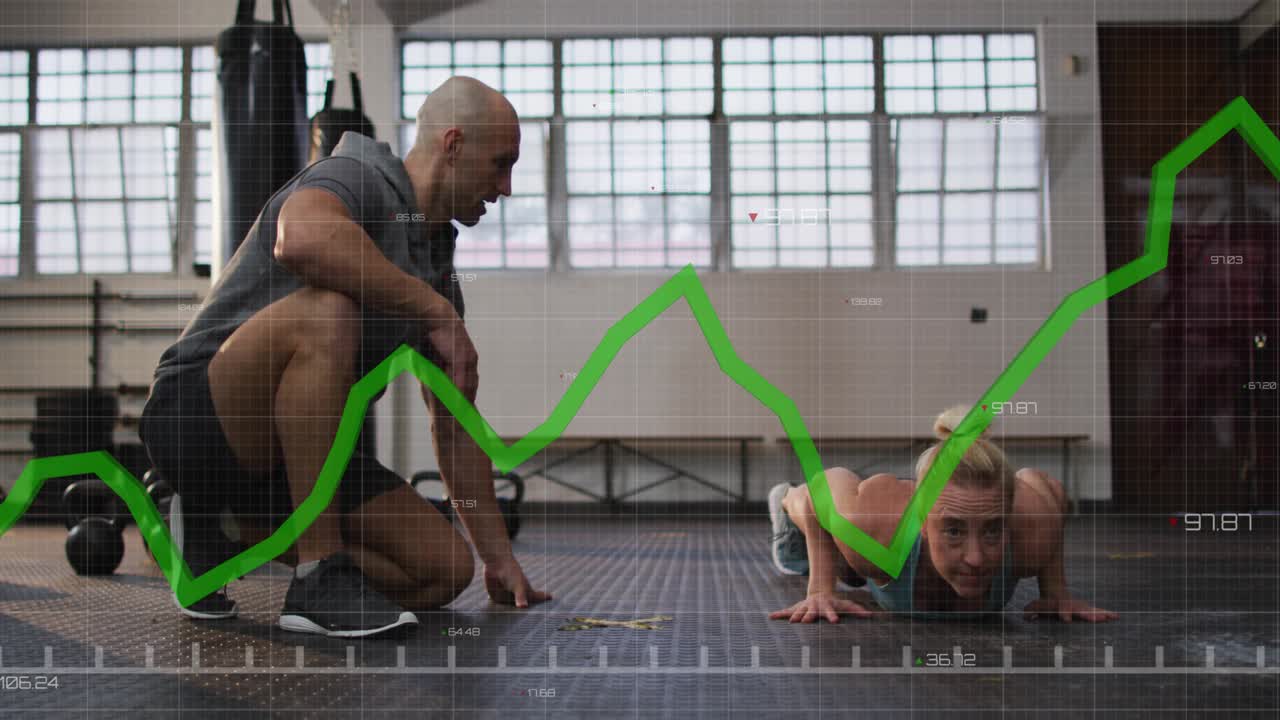 Coach cueing trainee in gym, trainee doing push-ups while green data line tracing reps for coaching