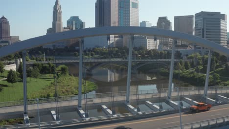 columbus, ohio close up of bridge and drone video moving up to skyline