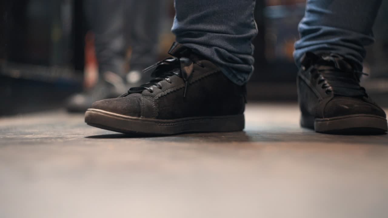Bartender taping foot on beat in a bar