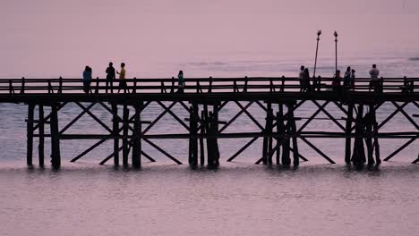 the mon bridge is an old wooden bridge located in sangkla, thailand