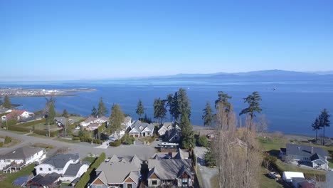 Aerial-View-of-houses-by-the-ocean