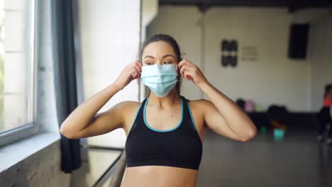 woman in sportswear in a studio