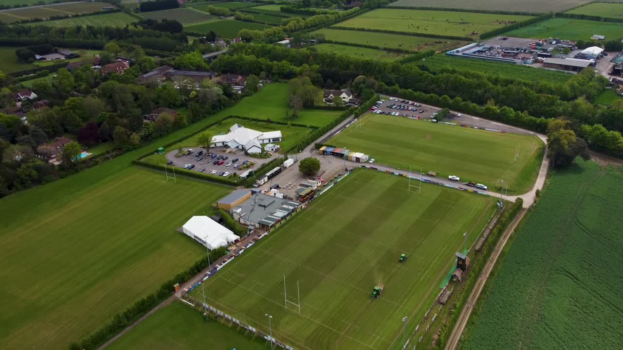 Aerial shot of Canterbury Rugby ground with two tractors cutting the grass
