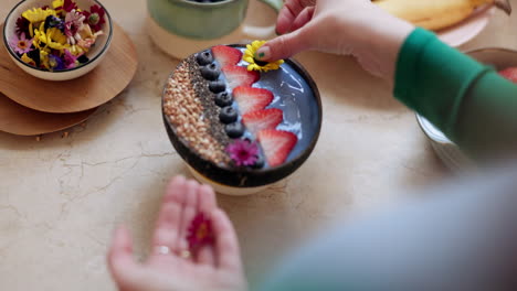 woman, hand and fruit bowl for breakfast