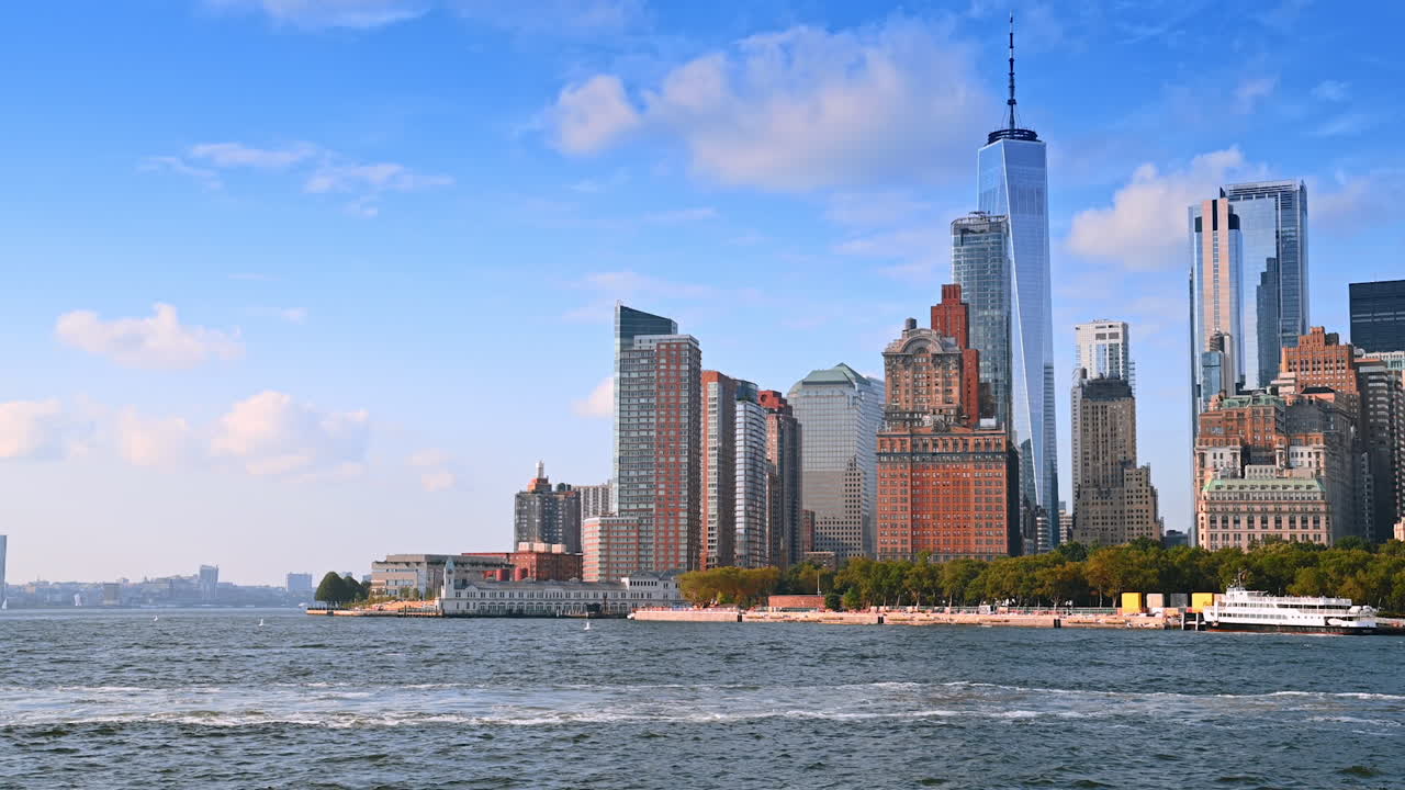 High-rises and skyscrapers of New York from the riverscape. Sightseeing during the boat tour at daytime