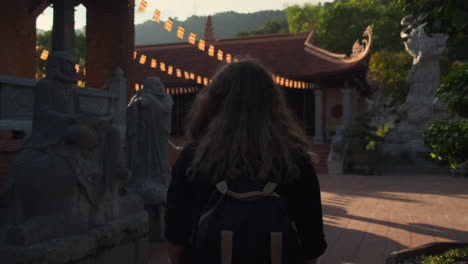 woman exploring a buddhist temple