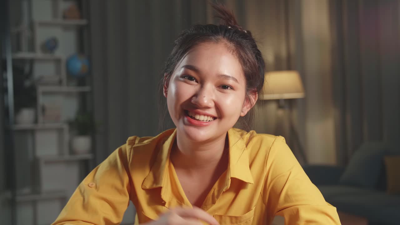 Young Woman Smiling in Front of Camera
