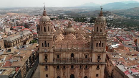 Spain-Jaen-Cathedral,-Catedral-de-Jaen,-flying-shoots-of-this-old-church-with-a-drone-at-4k-24fps-using-a-ND-filter-also-it-can-be-seen-the-old-town-of-Jaen