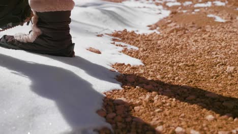 girl woman hiking with red rocks formation and snow near bryce canyon in southern utah-4