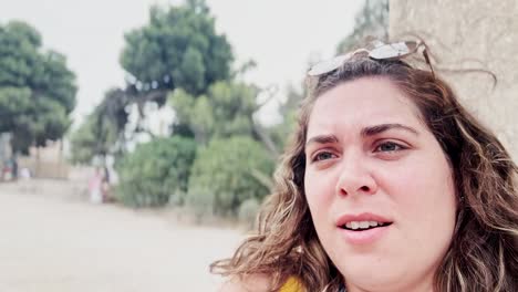 happy young woman vlogging her summer vacation in athens