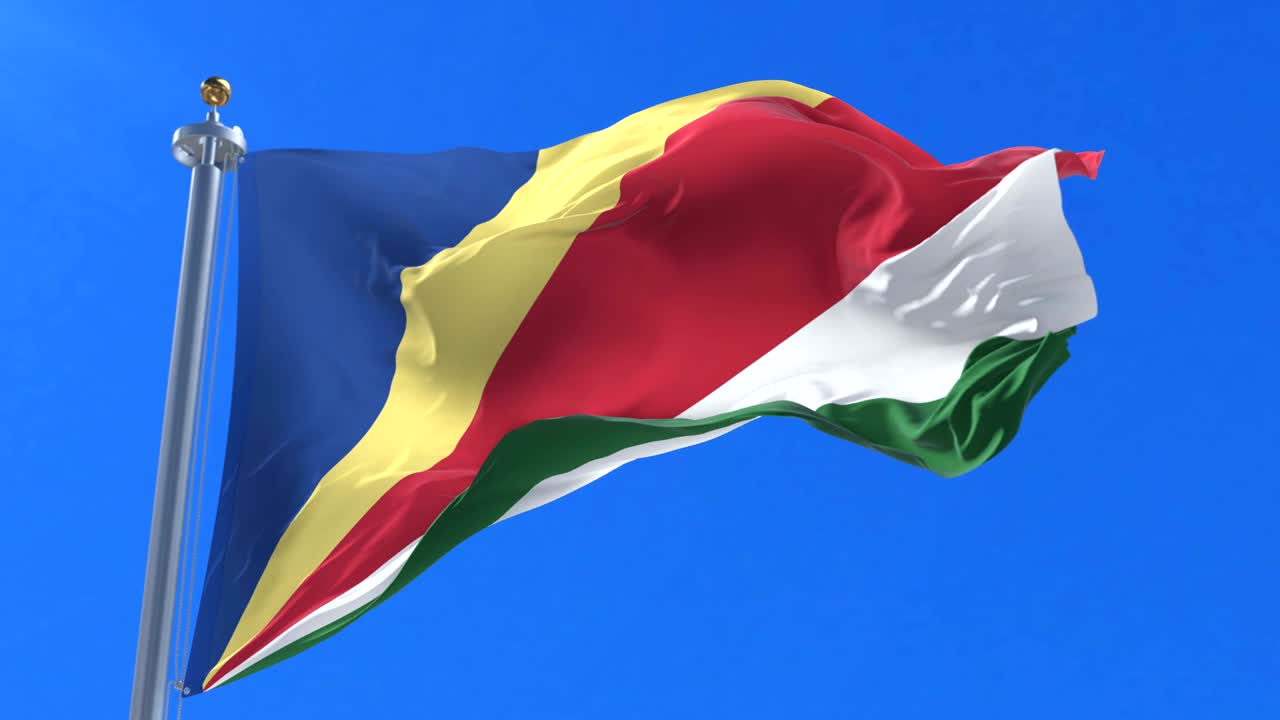 bandera de las seychelles agitando el viento lentamente en el cielo azul, bucle