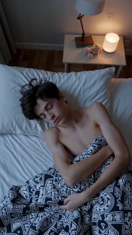 young person sleeping peacefully in bed