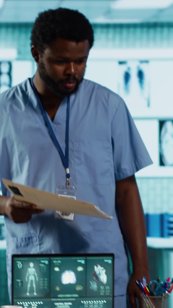 African American Doctor Receives Patient Files from Nurse in Clinic