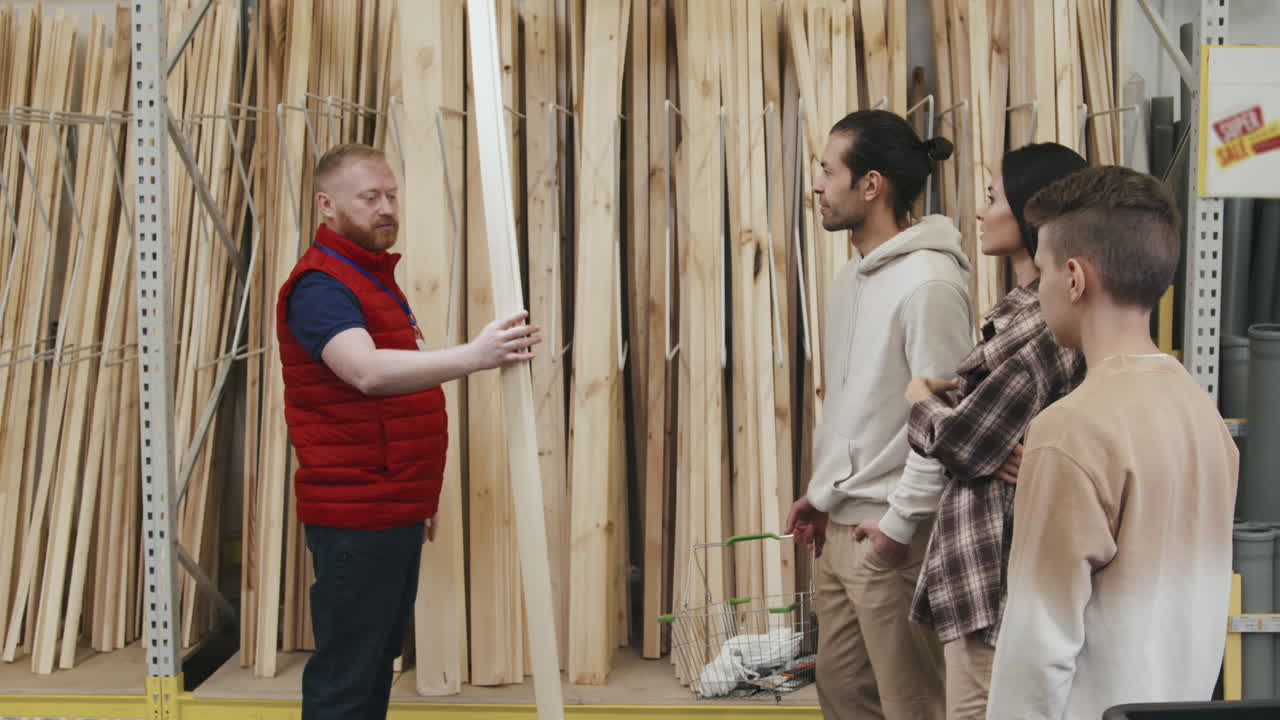 Hardware Store Employee Helping Family of Three