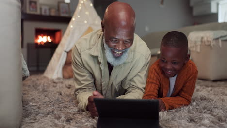Happy,-grandfather-and-kid-with-tablet-in-home