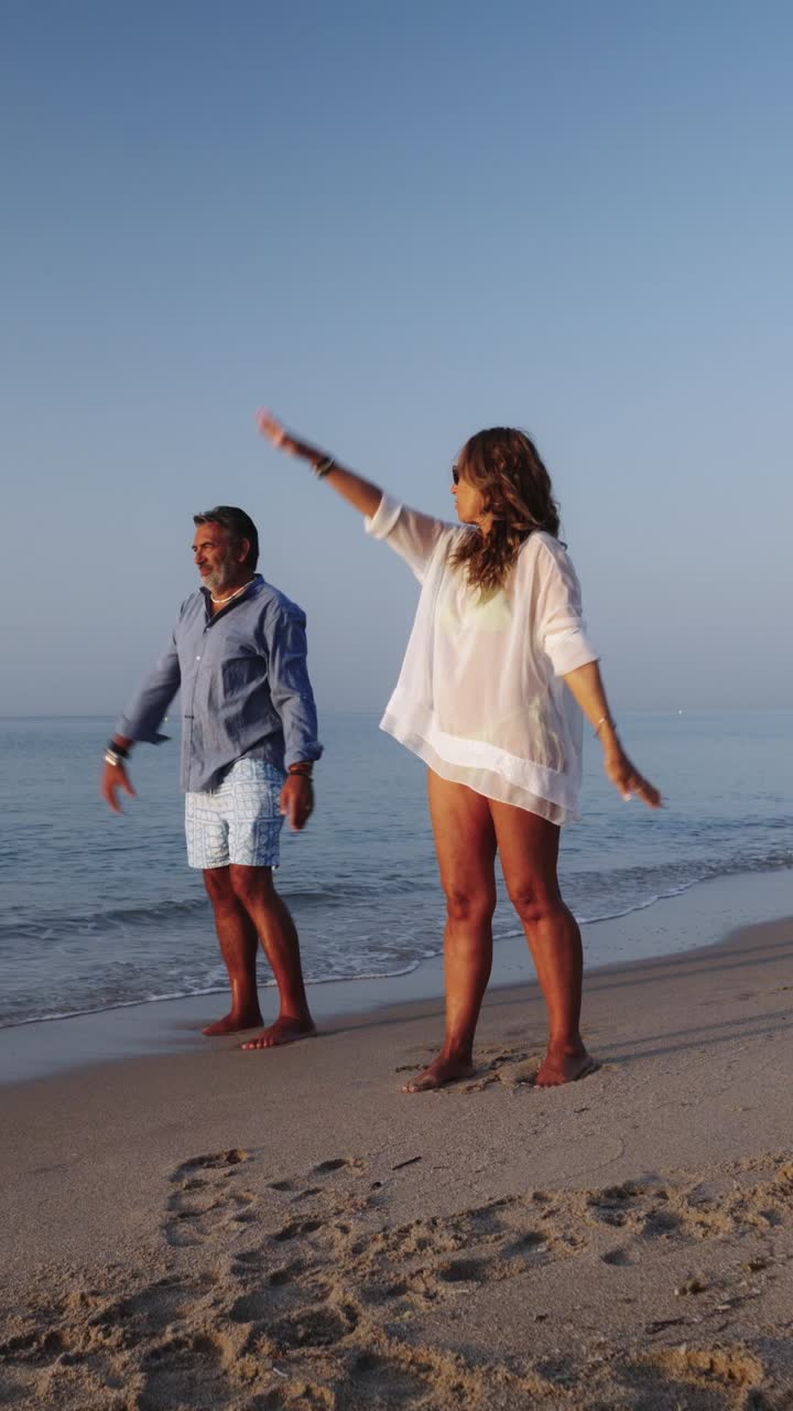 Couple Exercising on the Beach