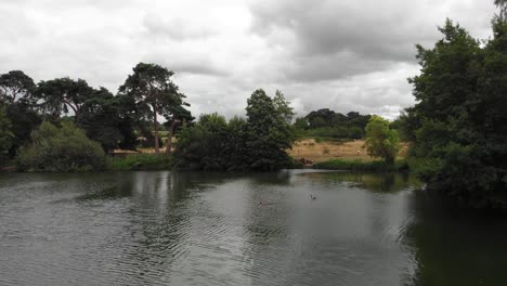 Aerial-drone-shot-over-the-Ely-great-ouse-river-during-a-cloudy-day