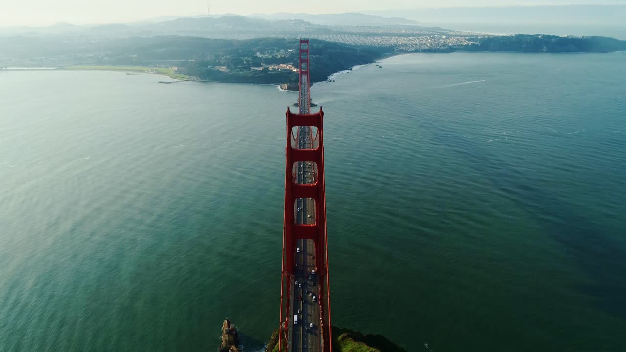 Golden Gate Bridge from head-on perspective glowing under early morning sun, 4K