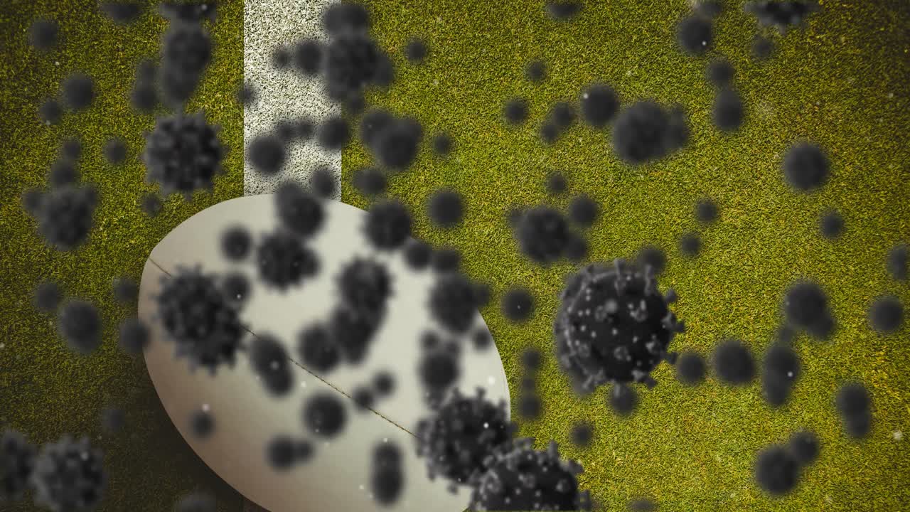 múltiples células de covid-19 flotando contra la pelota de rugby en el césped