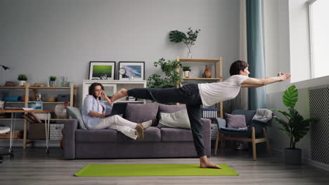 couple working from home and doing yoga