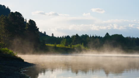 misty river or lake at sunrise