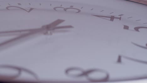 Timelapse-shot-of-a-black-and-white-clock-spinning