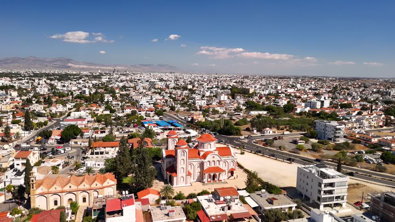 Enjoy a breathtaking view of the city landscape showcasing a mix of historic buildings and modern society. The scene captures the essence of urban life and nature in harmony