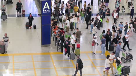 busy arrivals hall at an international airport