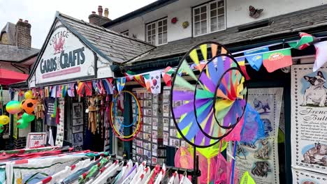 vibrant wind spinner outside a crafts shop