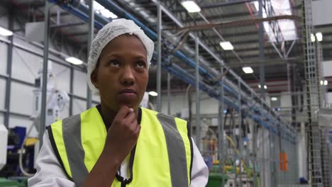 Warehouse female worker using digital tablet