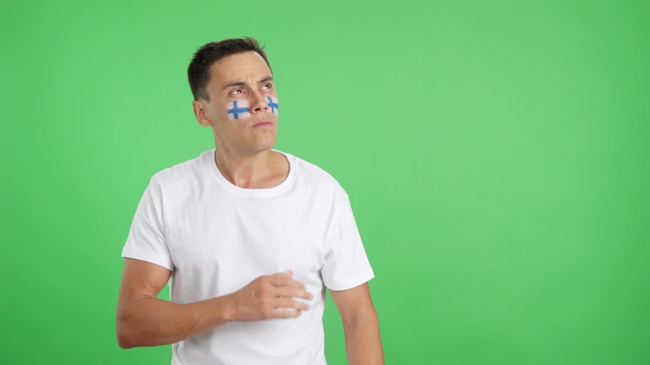 Man listening to the Finland national anthem with solemnity