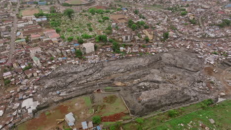 slow aerial flyover of a landfill in freetown in sierra leone