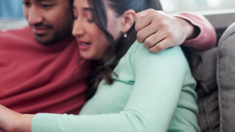 Happy,-hug-and-couple-on-a-sofa-with-phone