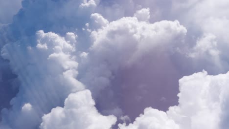 huge cumulonimbus clouds through an airplane window