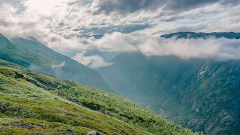 Timelapse-of-clouds-curling-and-sunbeams-between-the-mountains-of-Hardangervidda