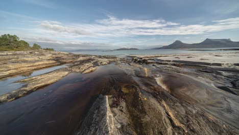 A-shallow-stream-flows-through-the-sandy-beach-and-connects-with-the-sea