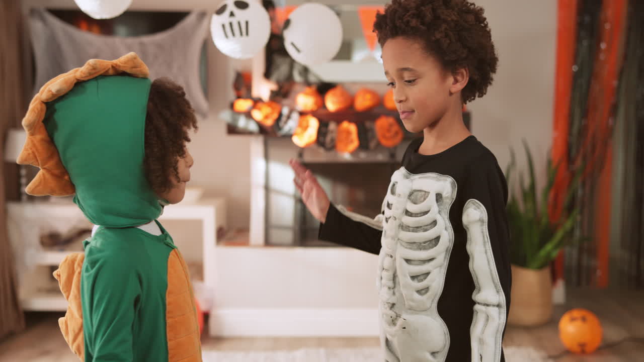 Boys in Halloween Costumes Celebrating at Home