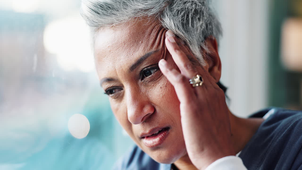 Mature woman experiencing headache and stress