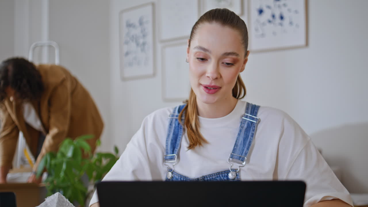 Concerned girl reading laptop email at home living room closeup. Young woman