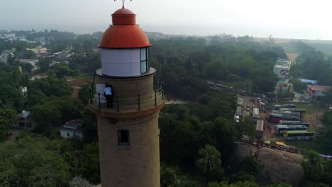 Light-house-of-mamallapuram-situated-among-famous-Rock-cut-Pallava-era-temples,-aerial-view-shot-on-Phantom-4-pro-4K-drone