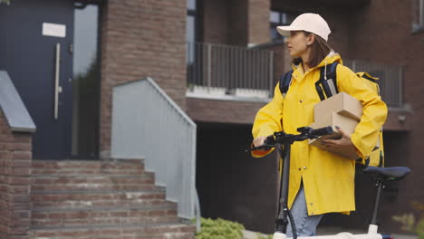 woman courier with electric bicycle