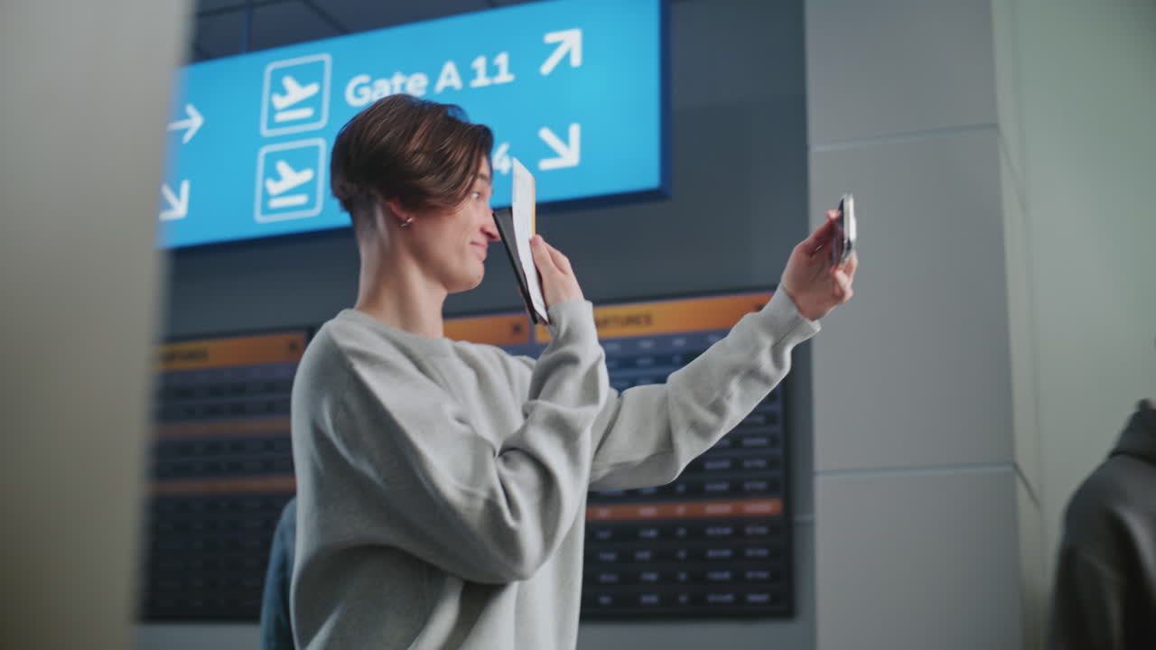 Man Taking a Selfie at the Airport