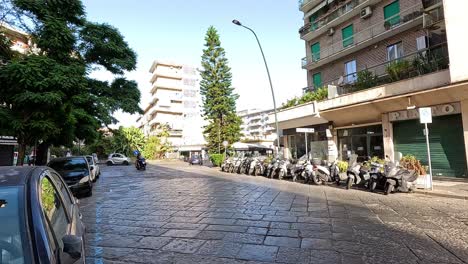 motorcycles and cars on a bustling street